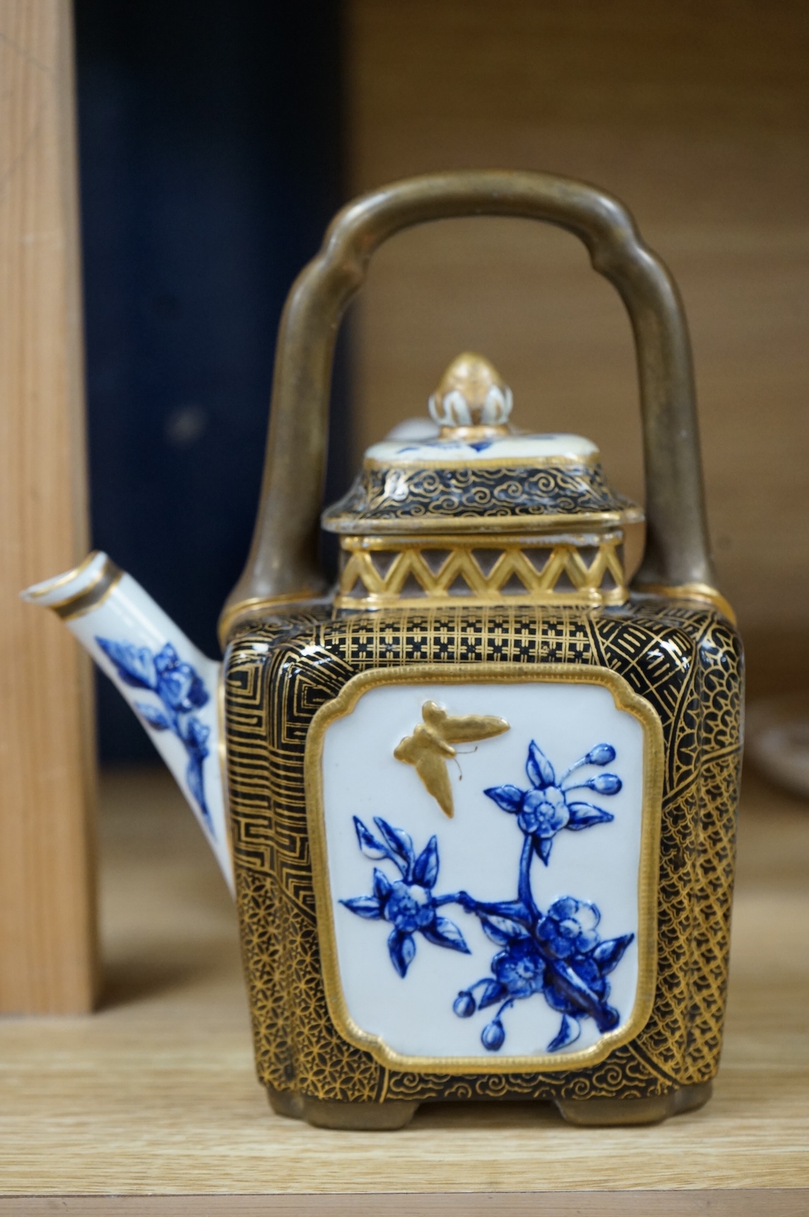 A Worcester butterfly handled cup and saucer and four other items, together with Royal Crown Derby, Dresden and Coalport items. (9). Tallest 13 cm